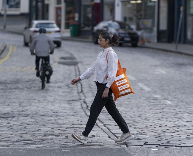 Pedestrian and cyclist on car free street