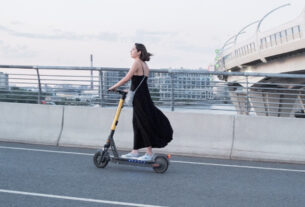 A girl riding an e-scooter