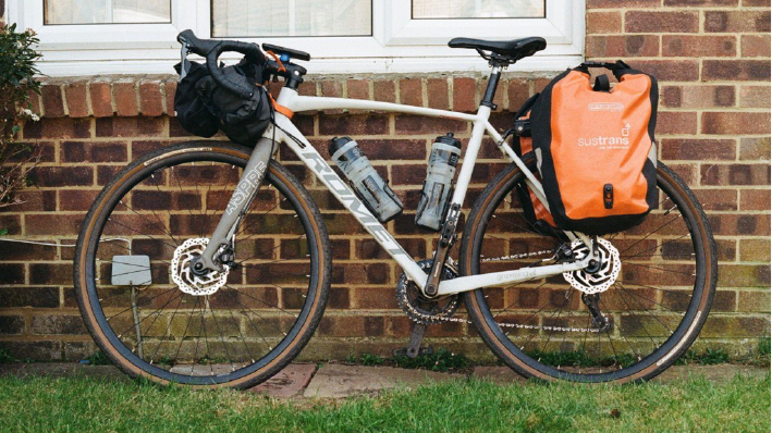 My preferred bikepacking setup: two pannier bags and a handlebar bag.
