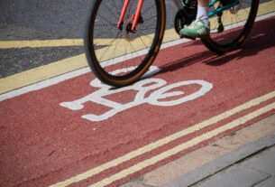 Image of bicycle wheel on a cycle lane